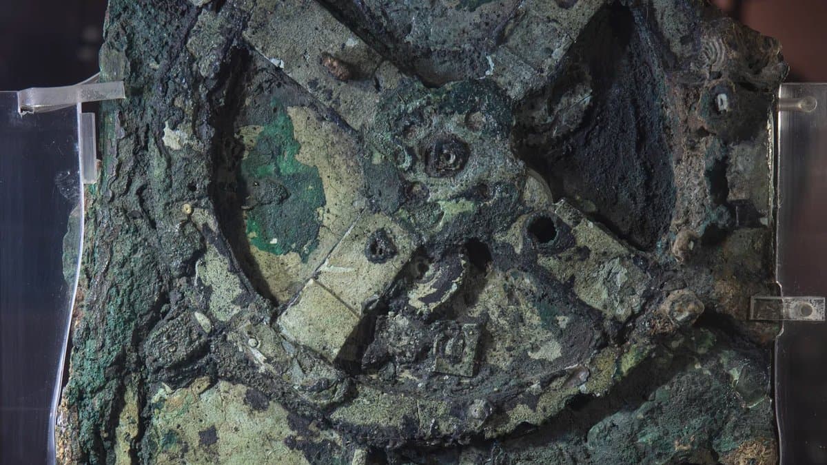 Corroded bronze Fragment A mounted for display, with parts of its gear train visible.