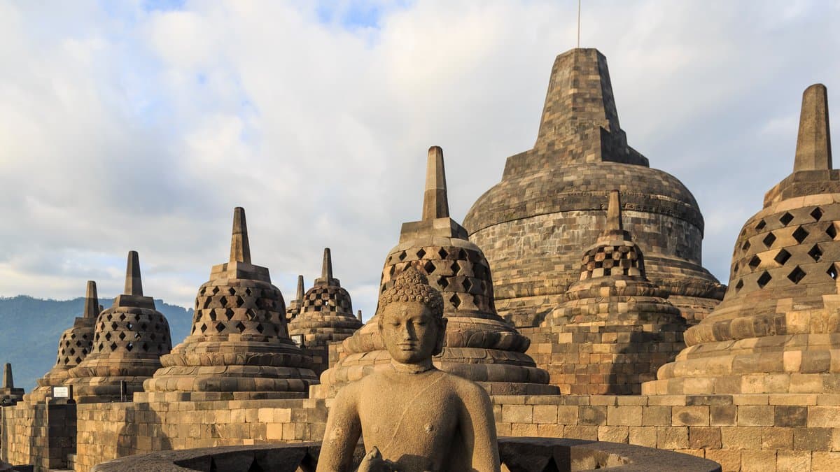 Perforated stone stupas on Borobudur’s upper circular terrace.