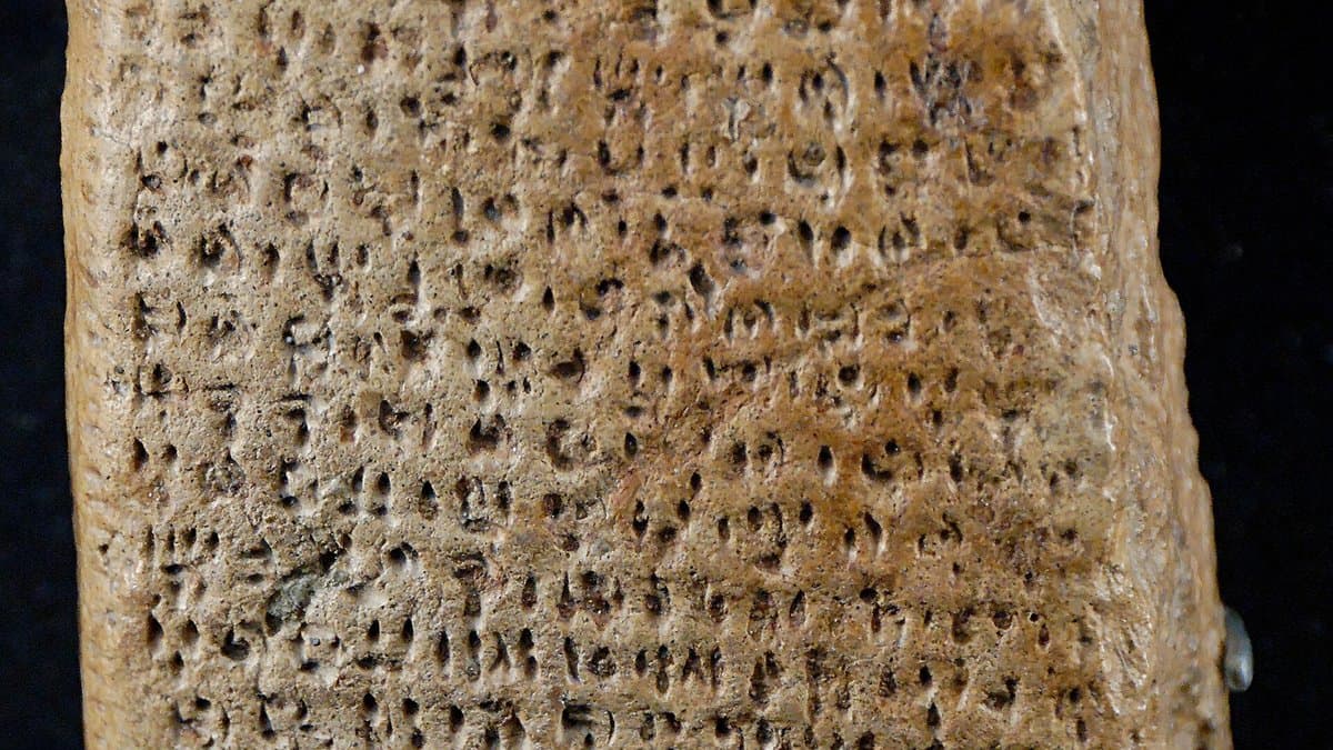Small clay tablet impressed with rows of signs.