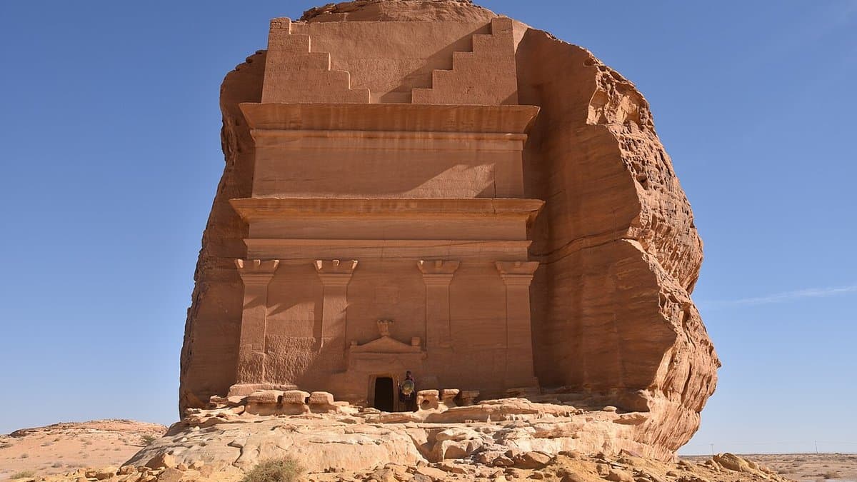 Isolated sandstone outcrop with the partly finished Nabataean tomb façade of Qasr al-Farid.