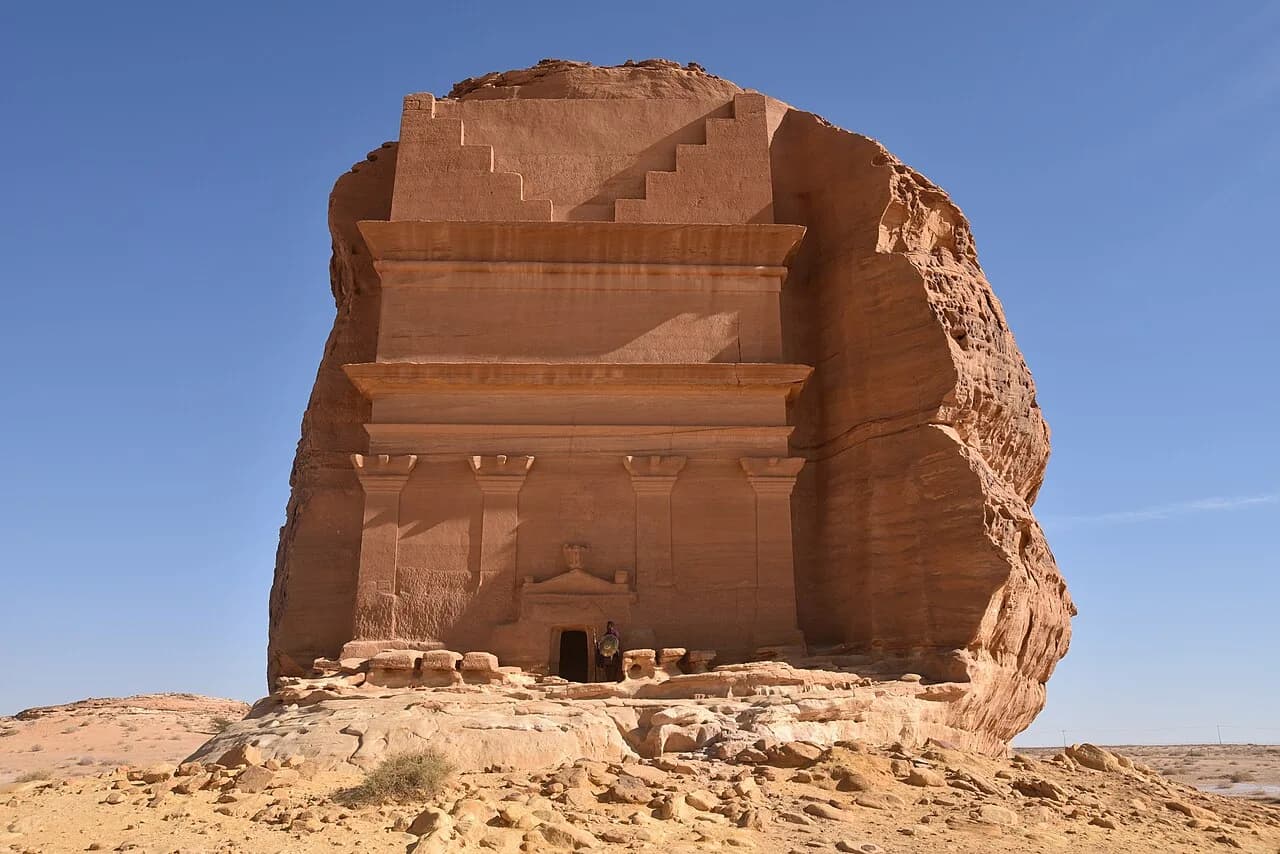 Isolated sandstone outcrop with the partly finished Nabataean tomb façade of Qasr al-Farid.