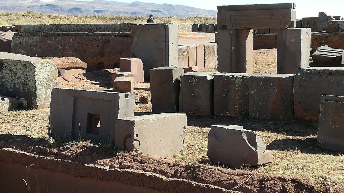 Carved stone blocks scattered across the Puma Punku archaeological area.