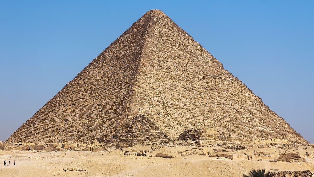 Weathered stone courses rising along the side of the Great Pyramid of Khufu at Giza.