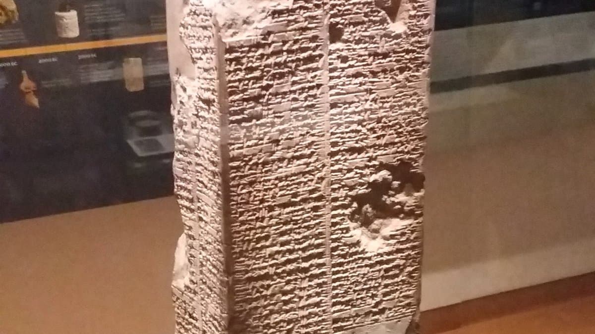 Four-sided clay prism densely inscribed with Sumerian cuneiform.