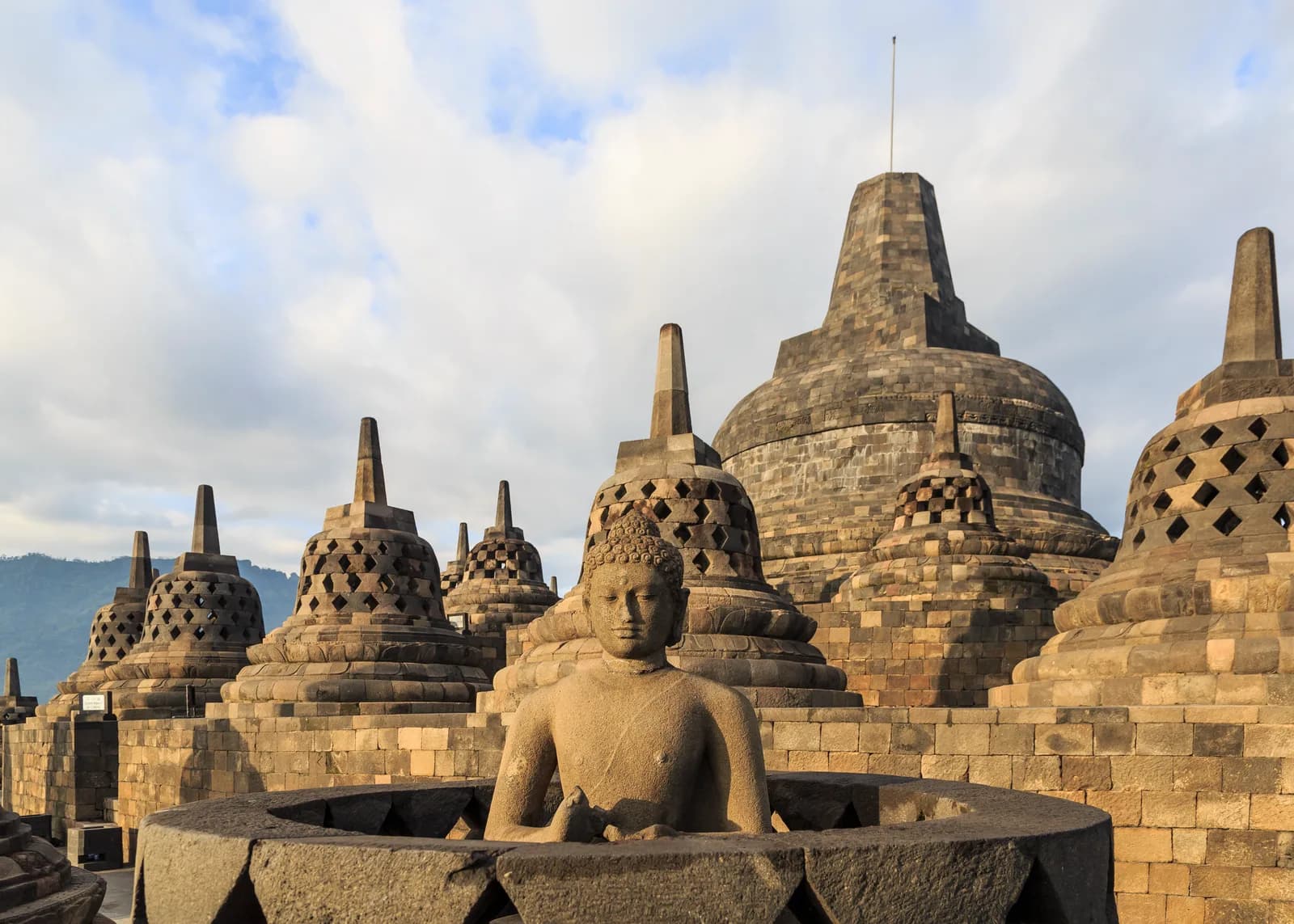 Perforated stone stupas on Borobudur’s upper circular terrace.