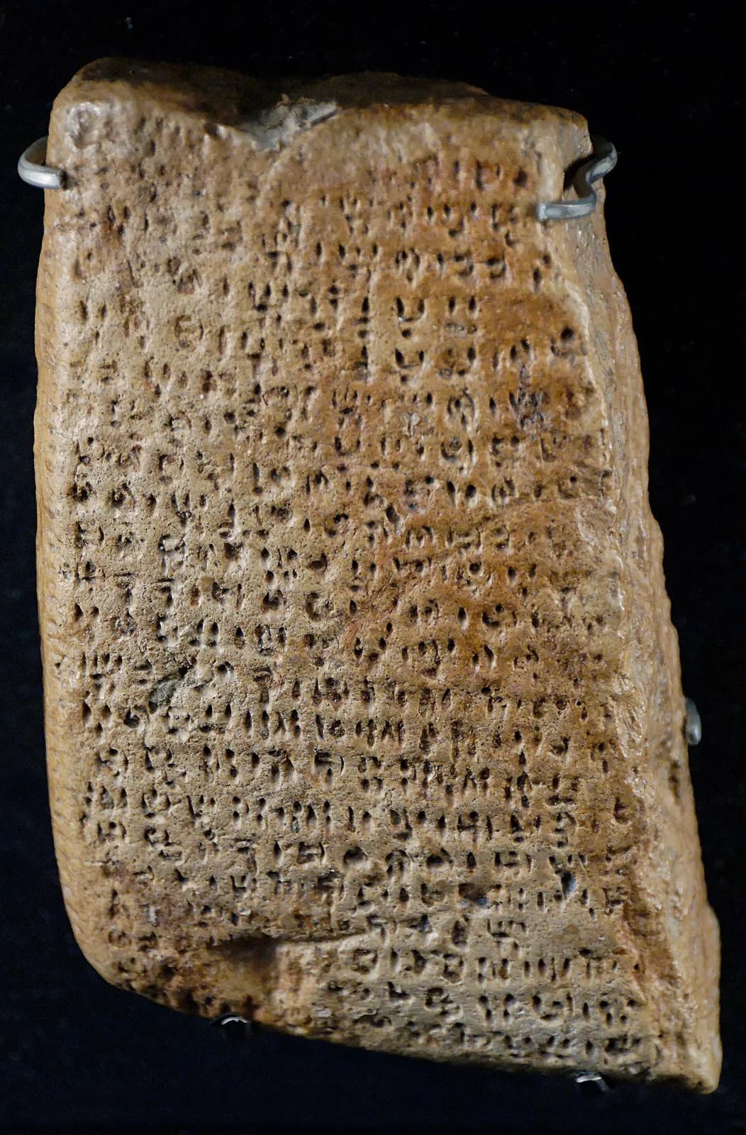 Small clay tablet impressed with rows of signs.