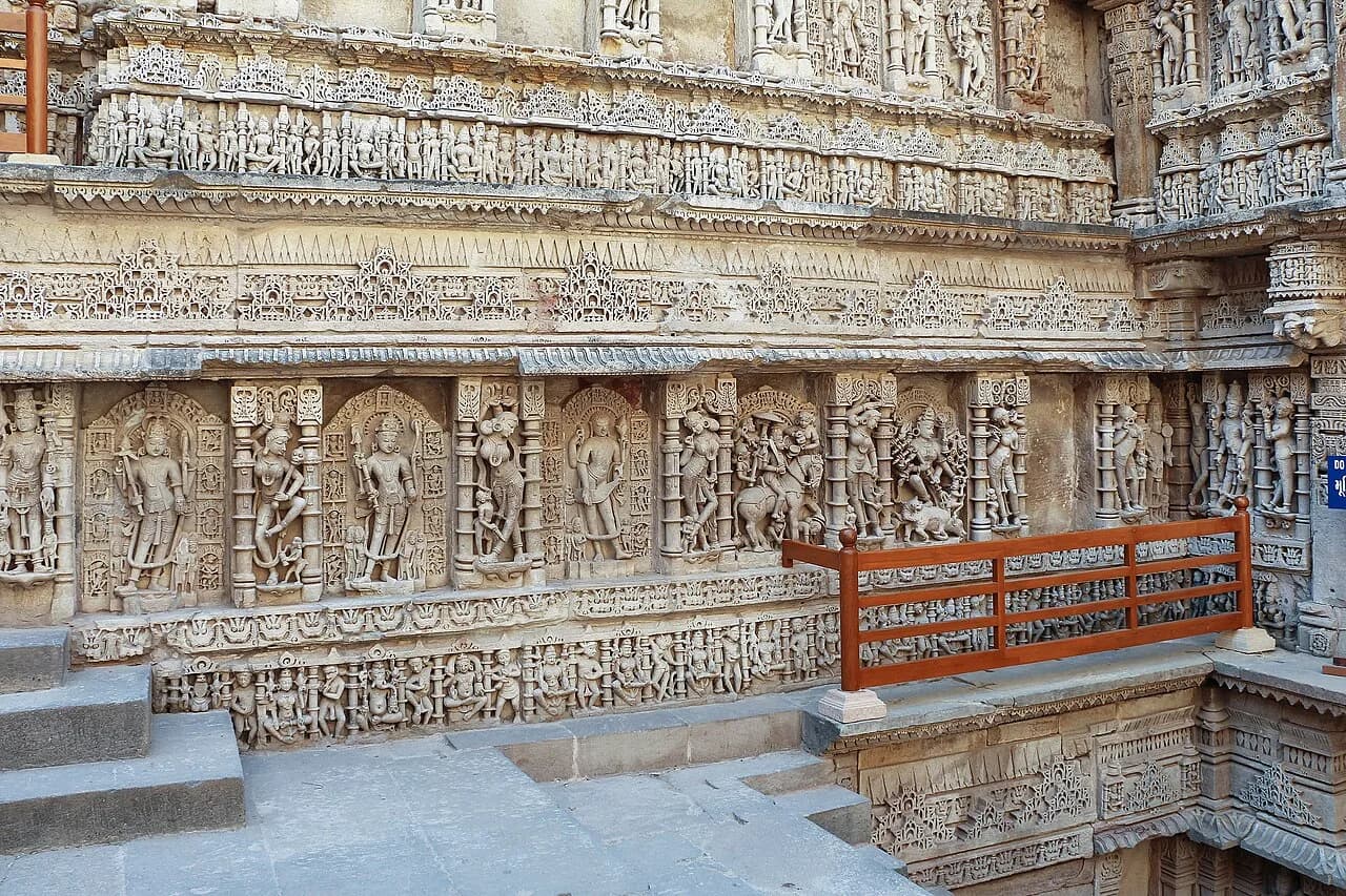 Ornately carved stone wall and landing within the Rani-ki-Vav stepwell.
