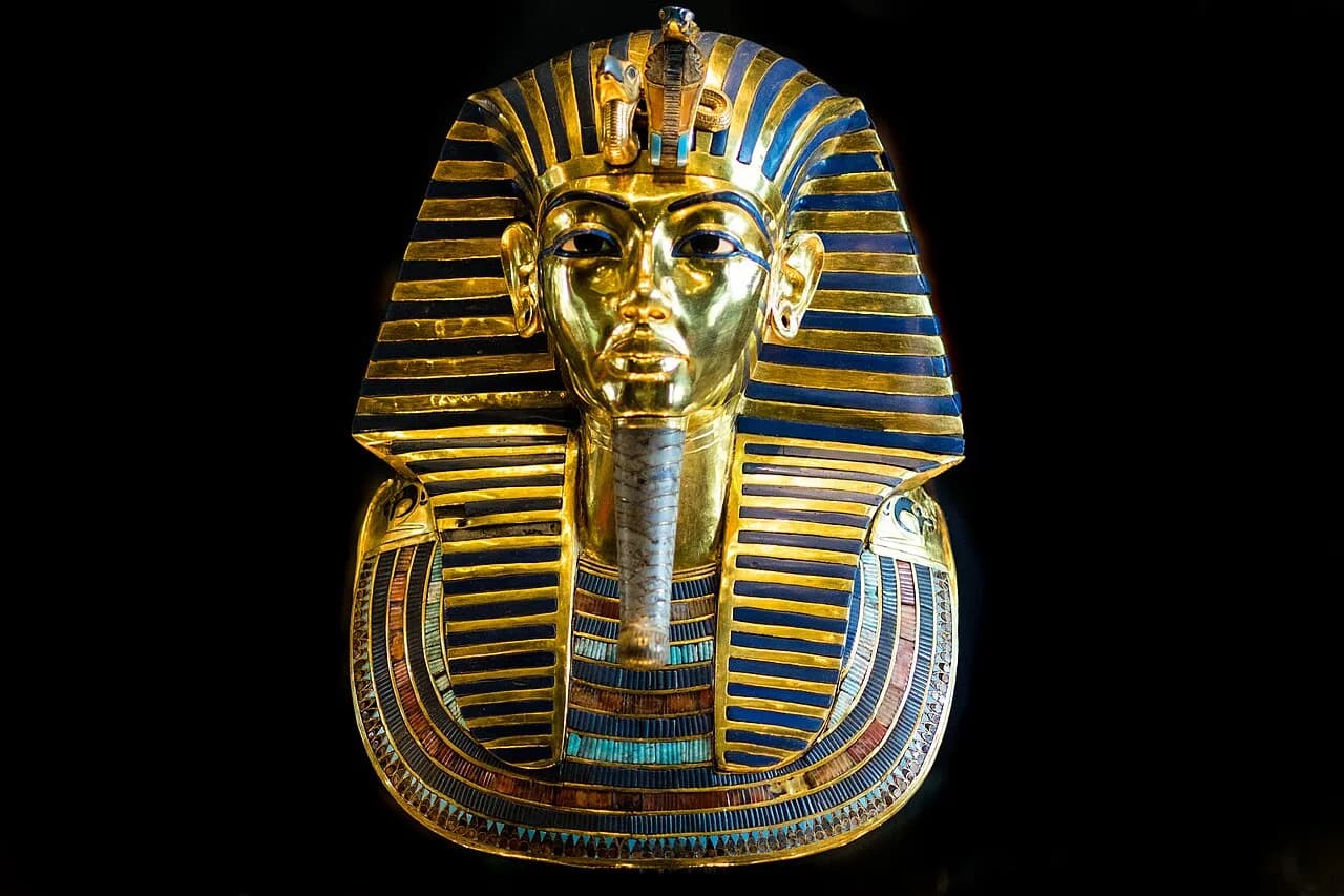 The famous burial mask of King Tutankhamun on display at the Egyptian Museum in Cairo, Egypt. The 24 pound (11 kilogram) mask is made of gold, glass